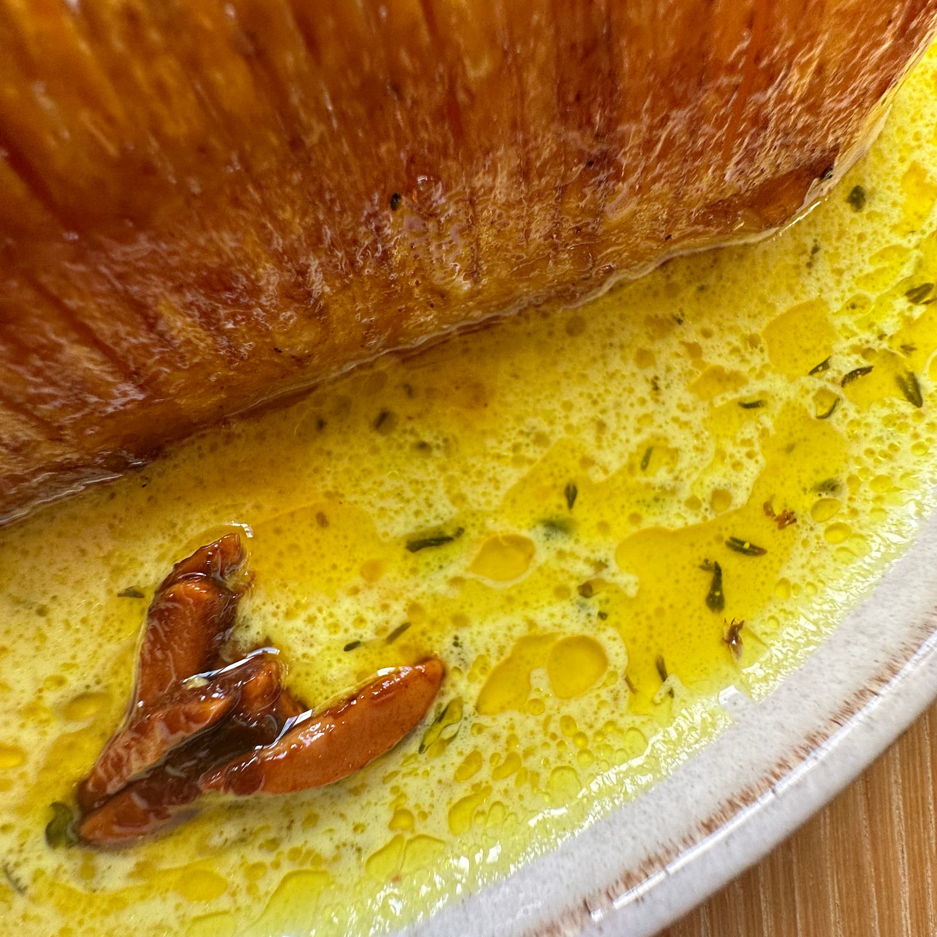 Closeup of the French beurre blanc sauce, butter and cream separated